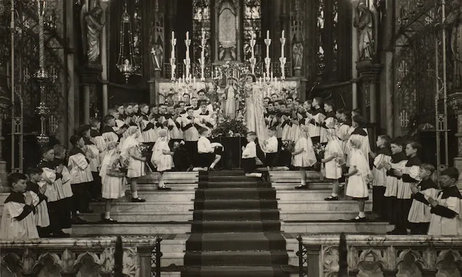 Historic photo of children and altar servers gathered at the St Walburge's sanctuary for the May Crowning of the Blessed Virgin Mary.