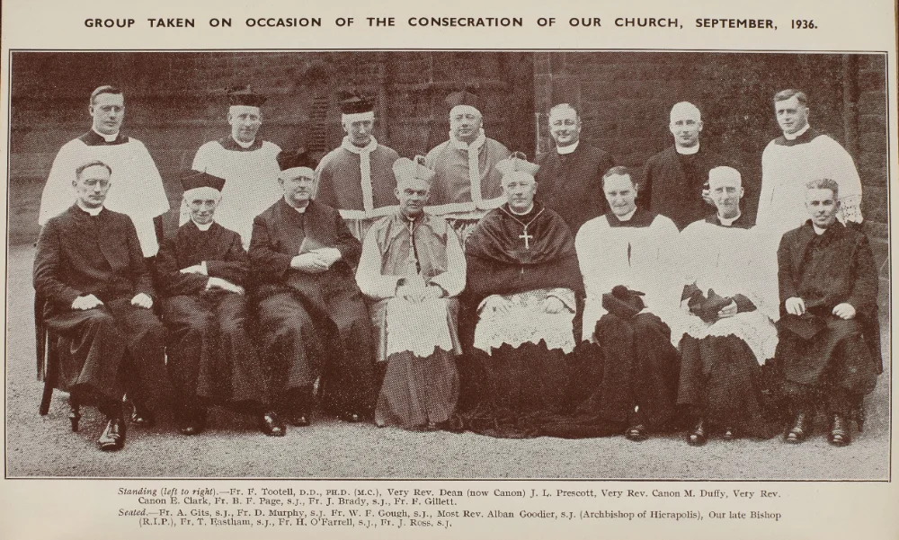 Group photograph marking the consecration of the church, September 1936. Clergy stand and sit outdoors. 