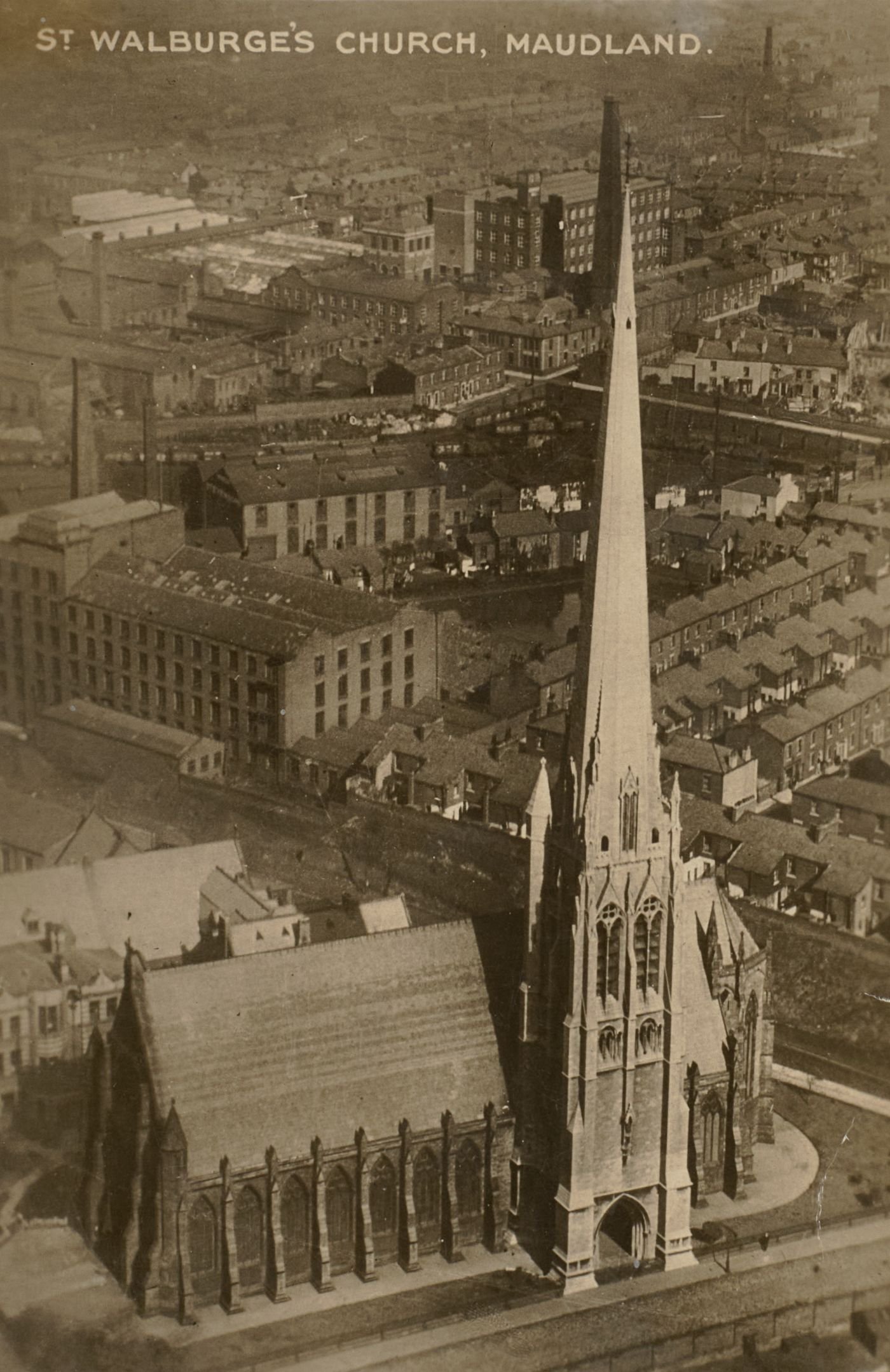 Printed postcard showing an aerial view of St Walburge's church and spire rising above the terraced streets and mill buildings of Maudland, captioned "St Walburge's Church, Maudland. 