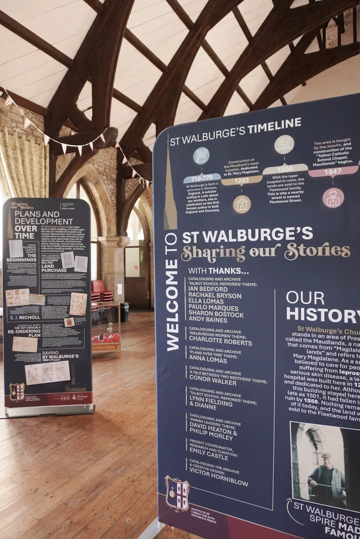 Exhibition banners in the hall at St Walburge's, showing a timeline of the church's history and a display on plans and development over time.