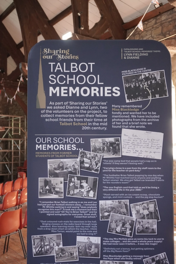 "Talbot School Memories" exhibition banner with black-and-white school photographs and pupils' recollections.